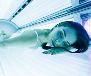 Woman In Tanning Bed